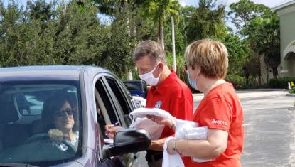 Volunteers handing out gifts
